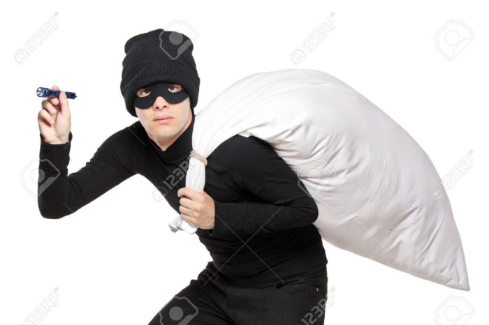 16639738-a-robber-with-a-bag-on-his-back-and-flashlight-isolated-on-white-background