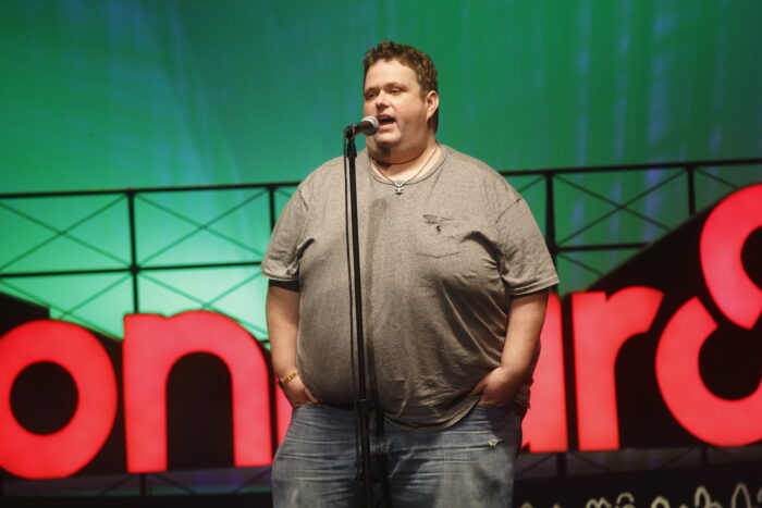 FILE - In this June 13, 2015 file photo, Ralphie May performs at the 2015 Bonnaroo Music and Arts Festival in Manchester, Tenn. The medical examiner in Las Vegas says comic May's death was from high blood pressure and heart disease. Clark County Coroner John Fudenberg said in a statement Wednesday, Dec. 6, 2017, that the round-faced comedian whose body was found Oct. 6 at a home in Las Vegas died of hypertensive cardiovascular disease. The death was ruled natural. (Photo by John Davisson/Invision/AP, File)