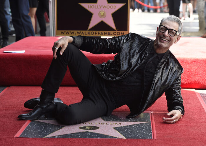 Actor Jeff Goldblum, best known for his roles in "The Fly," "Independence Day" and "Jurassic Park, poses atop his star on the Hollywood Walk of Fame following a ceremony in his honor on Thursday, June 14, 2018, in Los Angeles. (Photo by Chris Pizzello/Invision/AP)