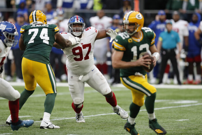 New York Giants defensive tackle Dexter Lawrence (97) aims to get past Green Bay Packers guard Elgton Jenkins (74) during an NFL football game at Tottenham Hotspur Stadium in London, Sunday, Oct. 9, 2022. The New York Giants won 27-22. (AP Photo/Steve Luciano)