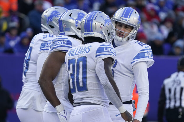 Detroit Lions quarterback Jared Goff (16) celebrates with running back Jamaal Williams (30) after Williams runs in a touchdown during the first half of an NFL football game, Sunday, Nov. 20, 2022, in East Rutherford, N.J. (AP Photo/Seth Wenig)