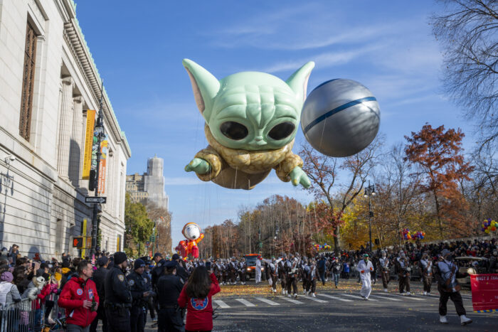 Handlers fly the Baby Yoda character helium balloon down Central Park West in New York City during the Macy's Thanksgiving Parade on Thursday, November 25, 2021. (AP Photo/Ted Shaffrey)