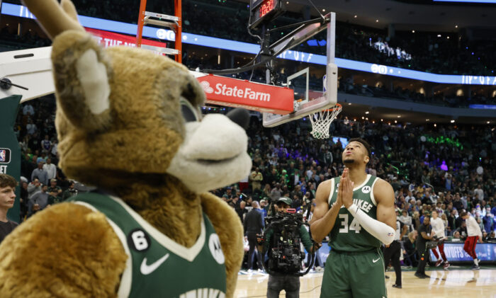 Milwaukee Bucks forward Giannis Antetokounmpo (34) gestures on the floor at the start of the first half of Game 5 in a first-round NBA basketball playoff series Wednesday, April 26, 2023, in Milwaukee. (AP Photo/Jeffrey Phelps)